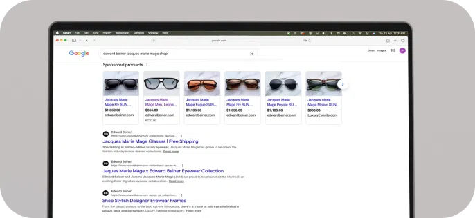 Search results on a laptop screen for eyewear brands Edward Beiner and Jacques Marie Mage. Displayed are sponsored sunglasses ads.